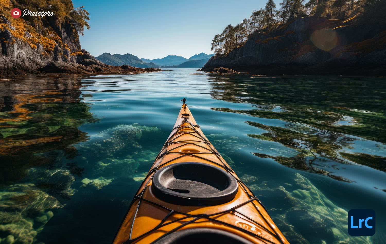 Kayak gliding over a serene Alaskan lake reflecting the surrounding mountains and dense forest